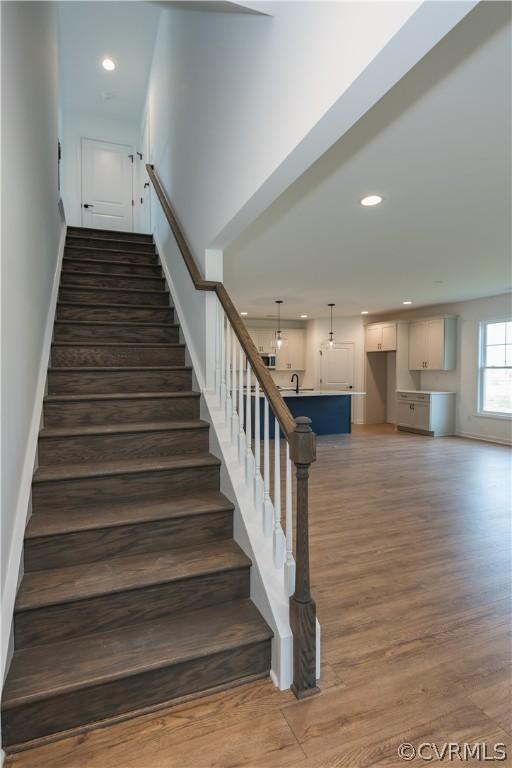 staircase featuring hardwood / wood-style flooring