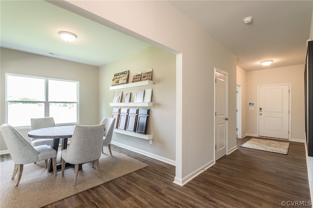 dining area with dark wood-type flooring