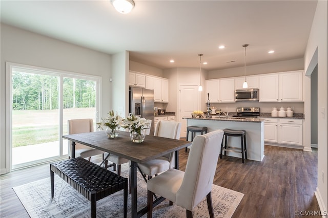 dining area with dark hardwood / wood-style floors