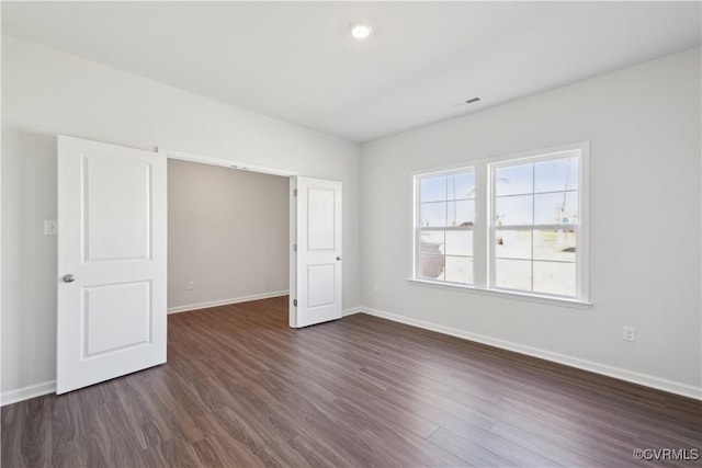 229 Bellevue Cir, King William, VA 23009 - unfurnished bedroom featuring baseboards and dark wood-style flooring