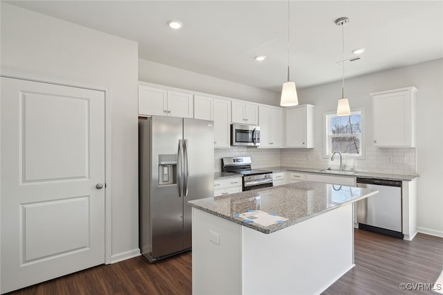 233 Bellevue Cir, King William, VA 23009 - kitchen featuring stainless steel appliances, dark wood-style floors, tasteful backsplash, a kitchen island, and recessed lighting