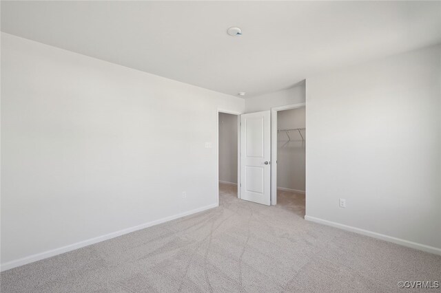 233 Bellevue Cir, King William, VA 23009 - unfurnished bedroom featuring baseboards, carpet, a spacious closet, and a closet