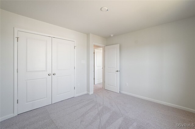 233 Bellevue Cir, King William, VA 23009 - unfurnished bedroom with carpet floors, baseboards, and a closet