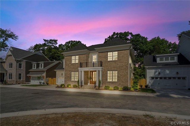 view of front of property with a balcony and a garage