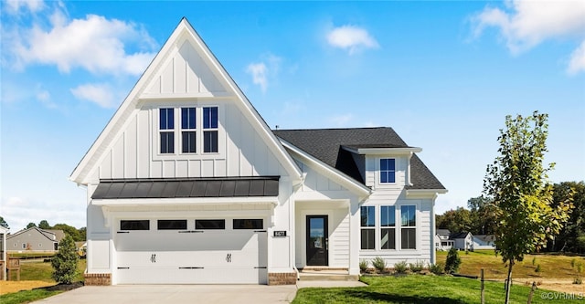 modern inspired farmhouse featuring a front lawn and a garage