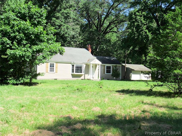 ranch-style home with a front yard