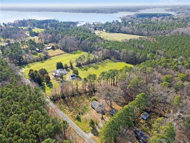 birds eye view of property featuring a rural view and a water view