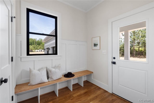 mudroom with ornamental molding and hardwood / wood-style floors