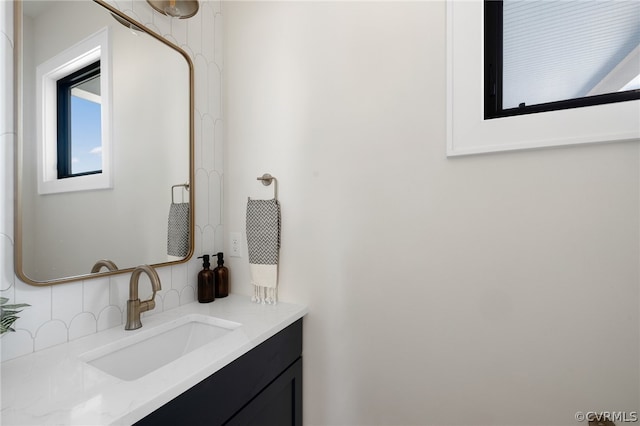 bathroom with backsplash and vanity