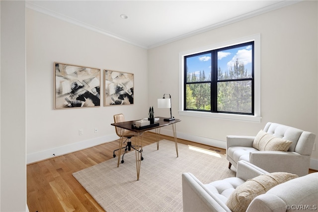 home office featuring light hardwood / wood-style flooring and crown molding