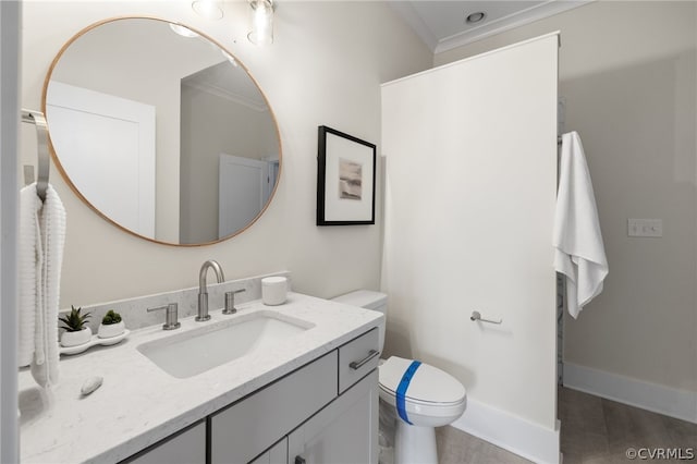 bathroom with crown molding, toilet, and vanity