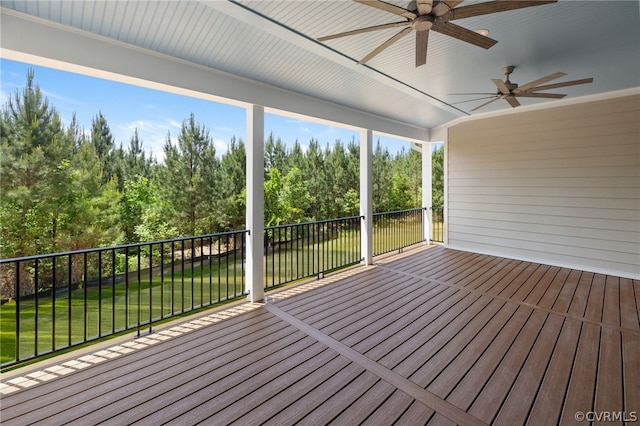 wooden terrace with a yard and ceiling fan