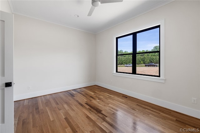 unfurnished room with wood-type flooring, ceiling fan, and crown molding