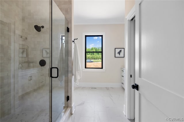 bathroom featuring tile floors, an enclosed shower, and vanity