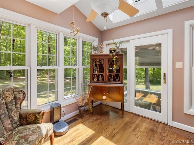 sitting room featuring ceiling fan, vaulted ceiling, and hardwood / wood-style floors