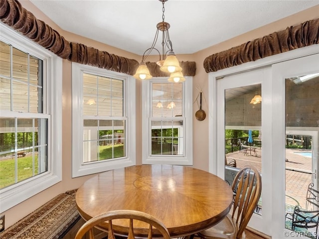 dining space with a chandelier