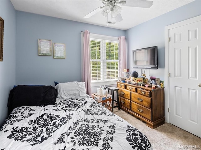 carpeted bedroom with ceiling fan