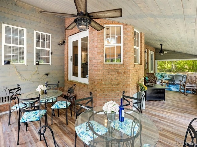 wooden terrace featuring ceiling fan and outdoor lounge area