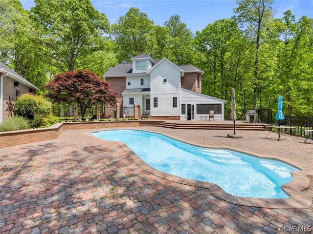 view of swimming pool with a patio area