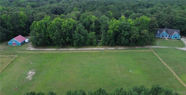 birds eye view of property with a rural view