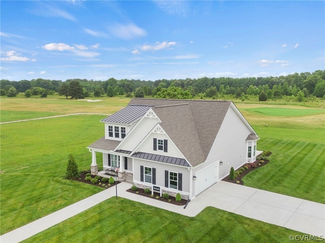 view of front of house with a front yard and covered porch