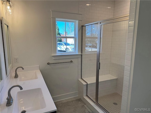 full bathroom with a sink and a shower stall