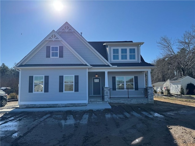 craftsman-style home featuring covered porch