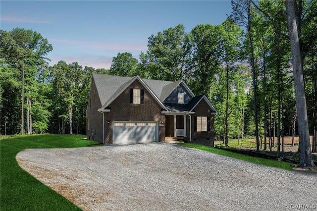 view of front of property featuring a garage and a front yard