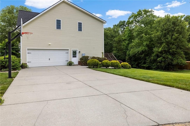 view of home's exterior featuring a garage and a lawn