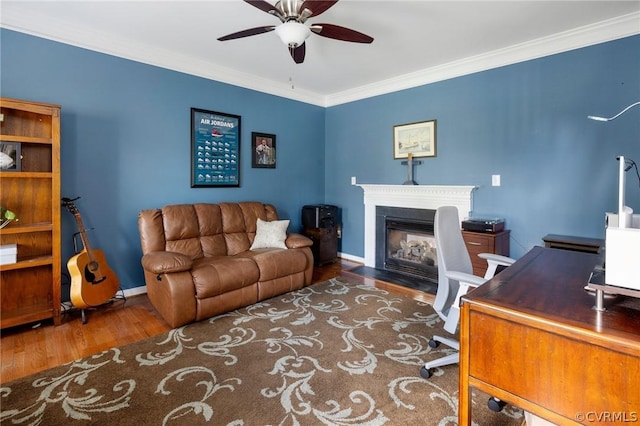 office featuring ceiling fan, ornamental molding, and dark hardwood / wood-style flooring