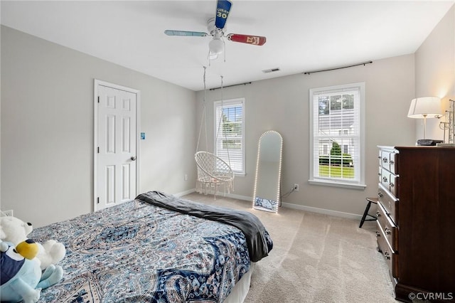 bedroom with light colored carpet and ceiling fan