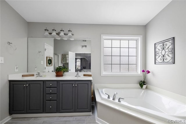 bathroom with vanity and a bathing tub