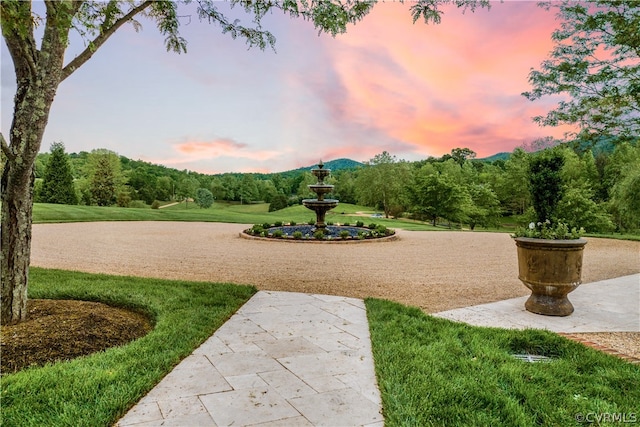 view of property's community featuring a yard