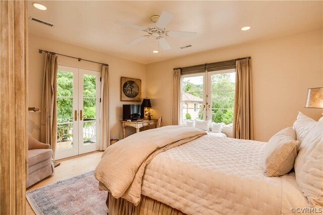 bedroom with access to outside, french doors, light wood-type flooring, and ceiling fan