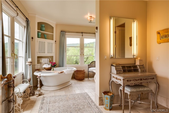 bathroom featuring a bath and tile flooring