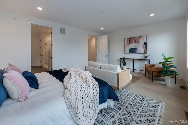 bedroom with recessed lighting, visible vents, and light wood-style flooring