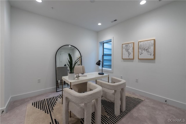 office featuring recessed lighting, visible vents, baseboards, and light colored carpet