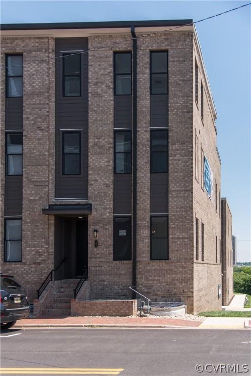 view of front of home featuring brick siding