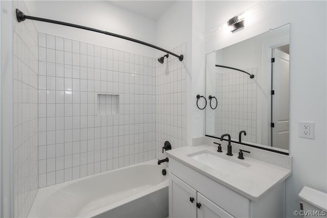 full bath featuring toilet, vanity, and bathing tub / shower combination