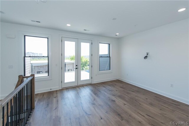 doorway to outside featuring visible vents, wood finished floors, recessed lighting, french doors, and baseboards