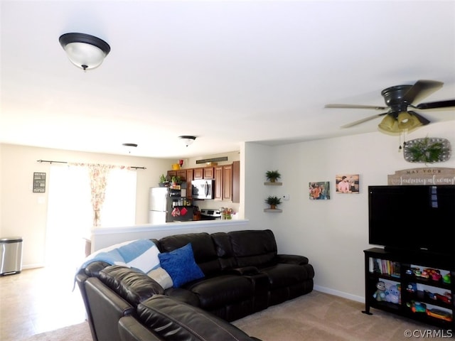 tiled living room featuring ceiling fan