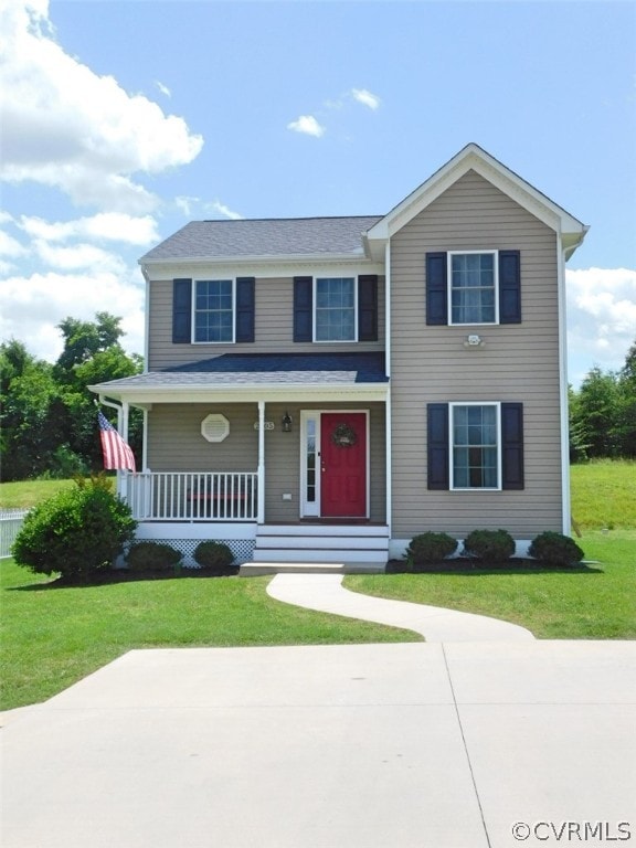 view of front facade featuring a front lawn and a porch