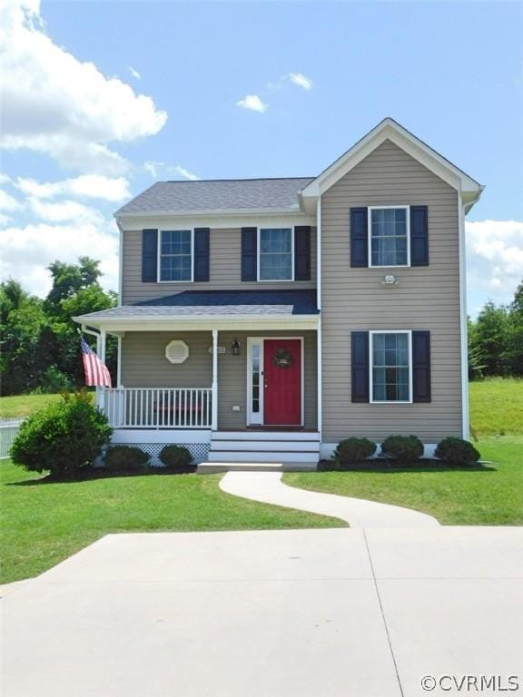 view of front of property featuring a front lawn and a porch