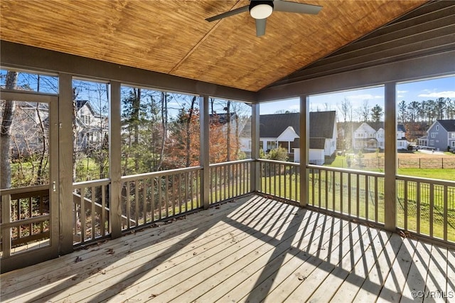 sunroom with vaulted ceiling, ceiling fan, and wooden ceiling