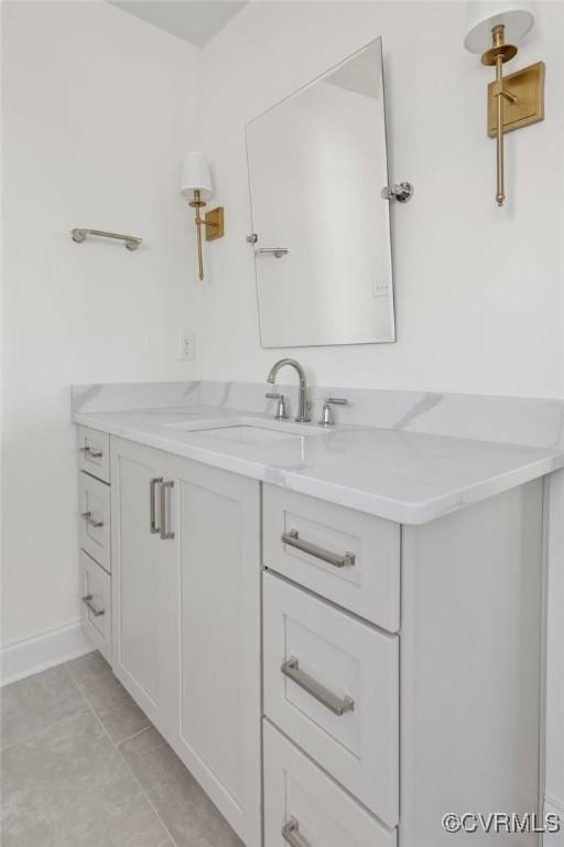 bathroom with tile patterned flooring and vanity