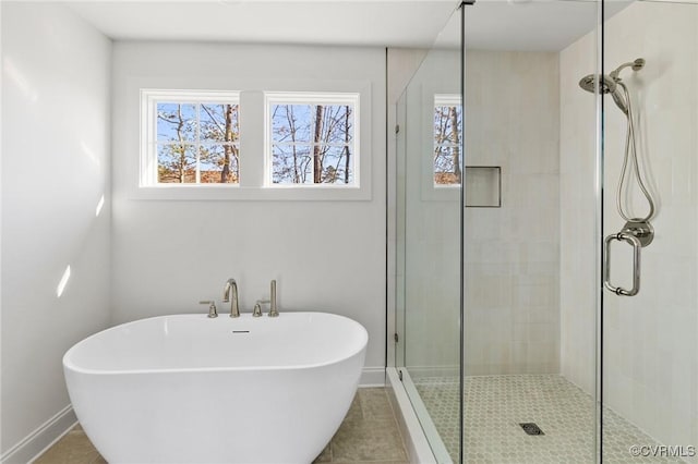 bathroom featuring tile patterned floors and plus walk in shower