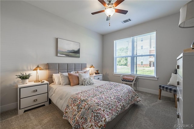 carpeted bedroom with ceiling fan and lofted ceiling