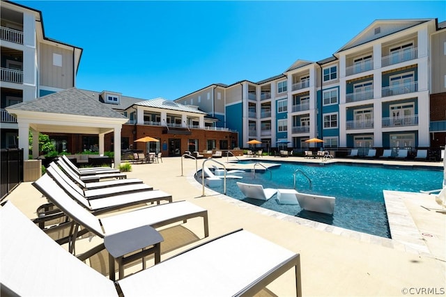 view of swimming pool featuring a patio