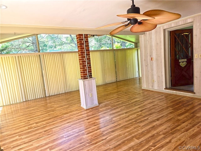 interior space with vaulted ceiling and ceiling fan