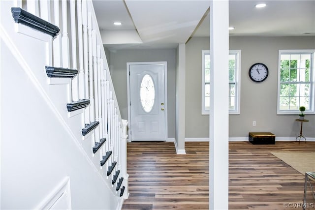 foyer entrance with dark wood-type flooring